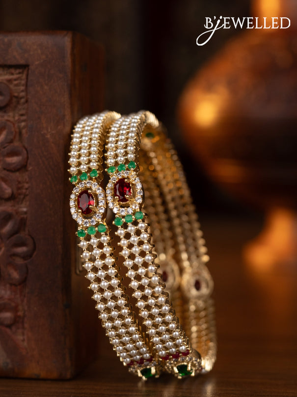 Pearl bangles with multicolour & cz stones and pearls in gold finish
