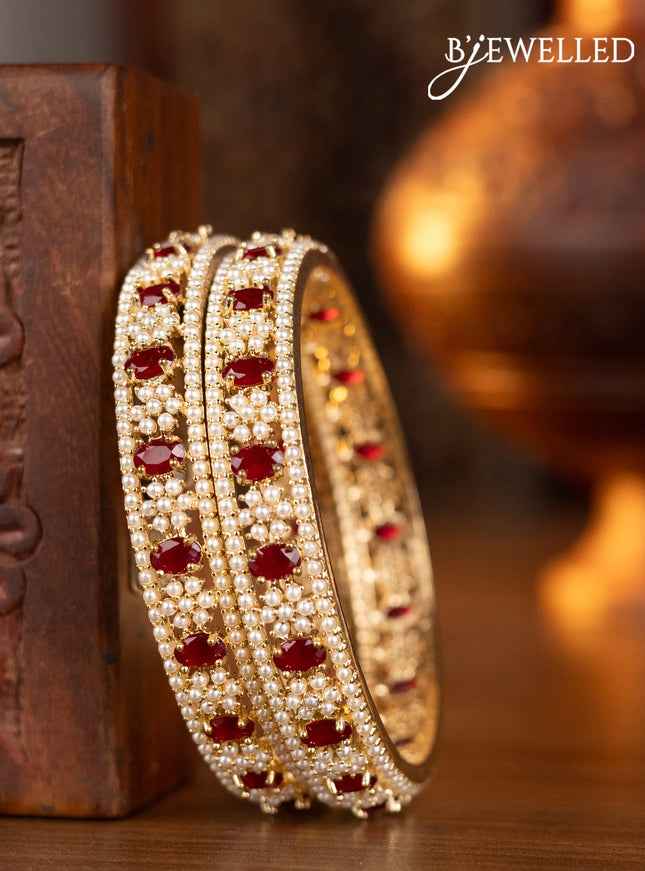 Pearl bangles with ruby stones and pearls in gold finish
