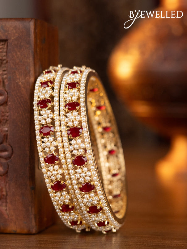 Pearl bangles with ruby stones and pearls in gold finish