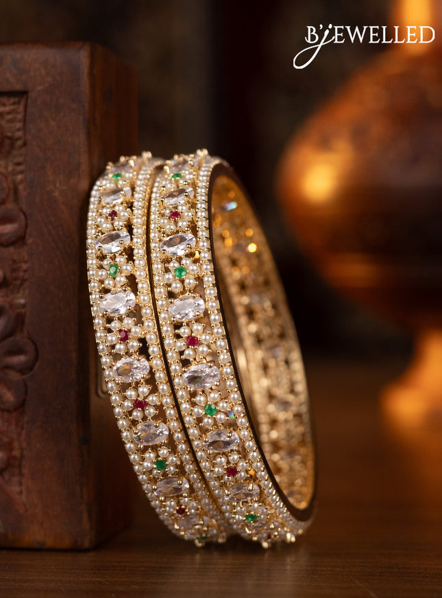 Pearl bangles floral design with kemp & cz stones and pearls in gold finish