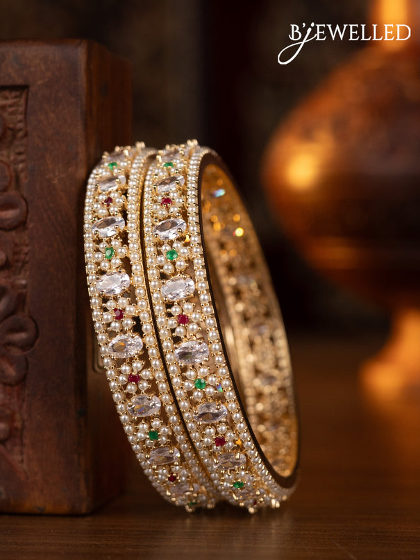 Pearl bangles floral design with kemp & cz stones and pearls in gold finish