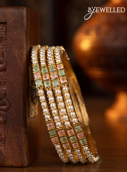 Pearl bangles floral design with mint green & baby pink stones and pearls in gold finish