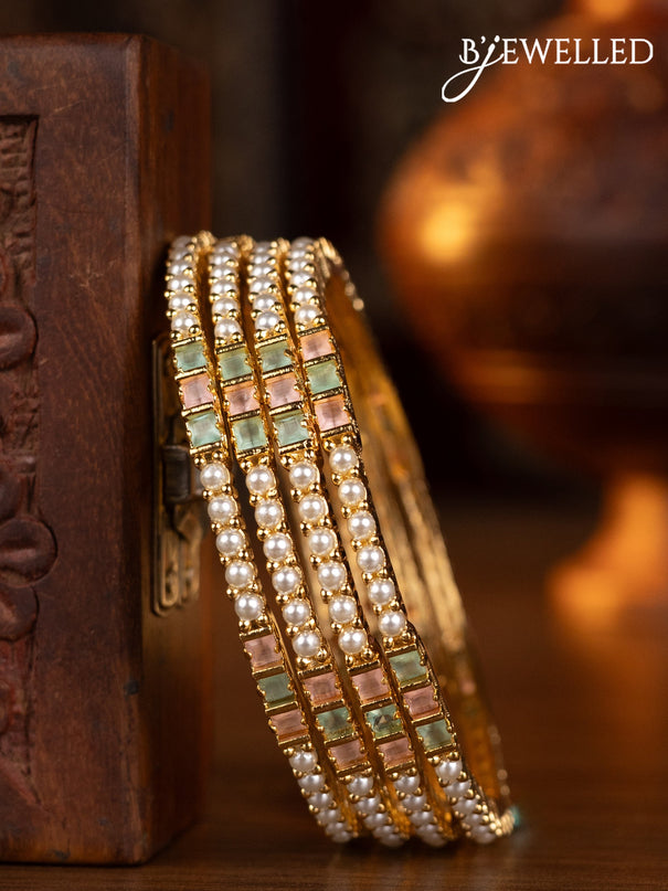 Pearl bangles  design with mint green & baby pink stones and pearls in gold finish