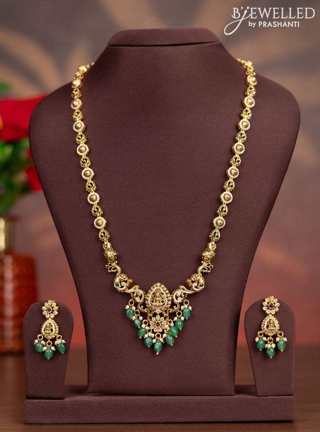 Antique haaram lakshmi design with kemp & cz stones and pearl & green beads hangings
