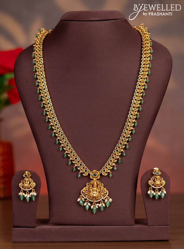 Antique haaram lakshmi pendant with kemp & cz stones and pearl & mint green beads hangings