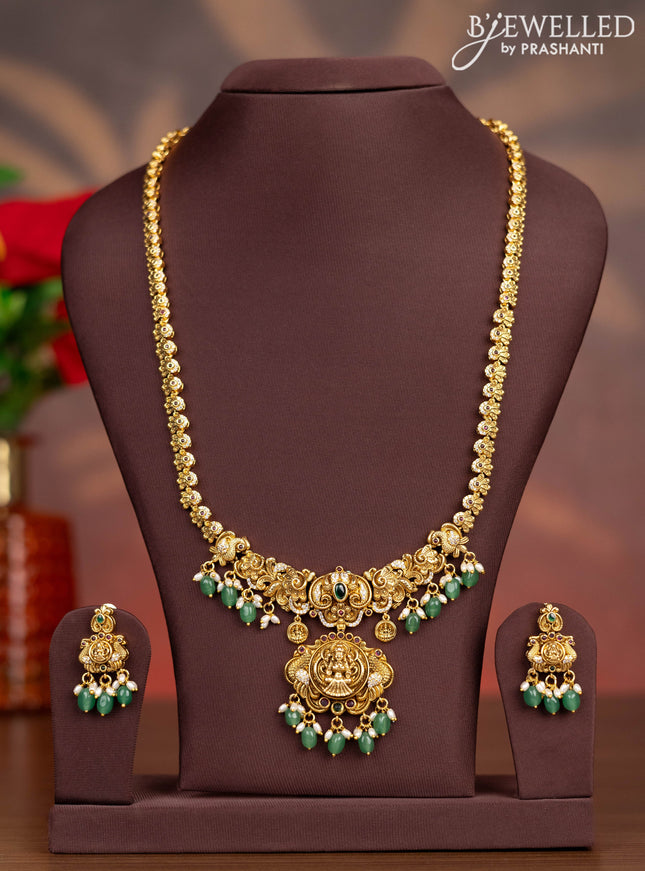 Antique haaram lakshmi pendant with kemp & cz stones and pearl & mint green beads hangings