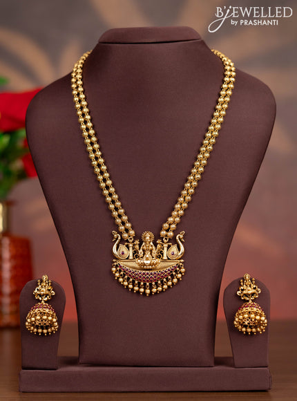 Antique haaram lakshmi pendant with pink kemp stones and golden beads hangings