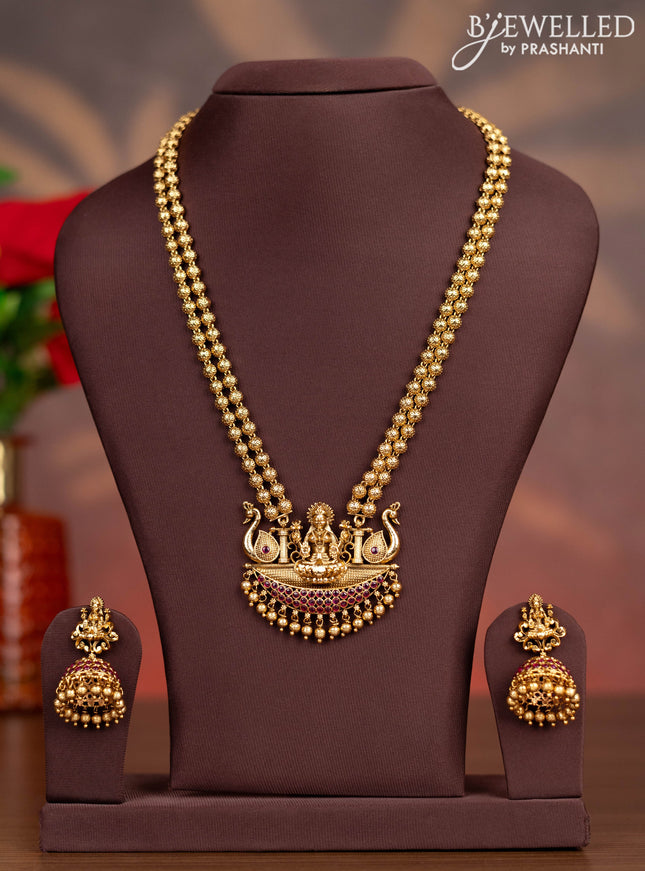 Antique haaram lakshmi pendant with pink kemp stones and golden beads hangings