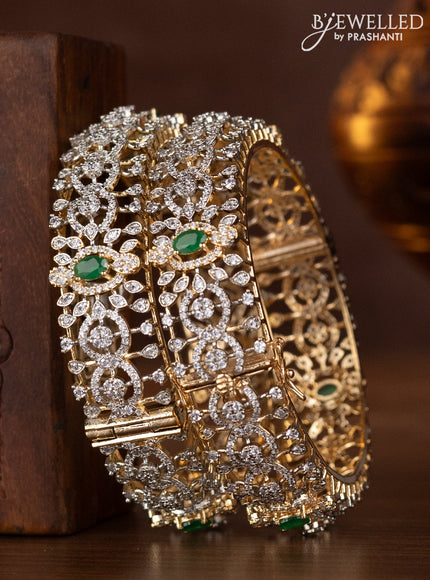 Zircon bangles with emerald and cz stones in gold finish