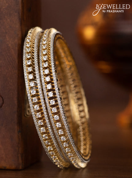 Zircon bangles with cz stones in gold finish