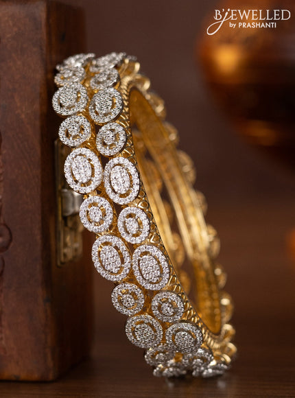 Zircon bangles with cz stones in gold finish