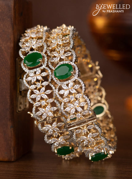 Zircon bangles with emerald and cz stones in gold finish