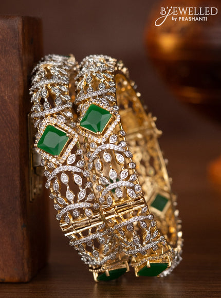 Zircon bangles with emerald and cz stones in gold finish