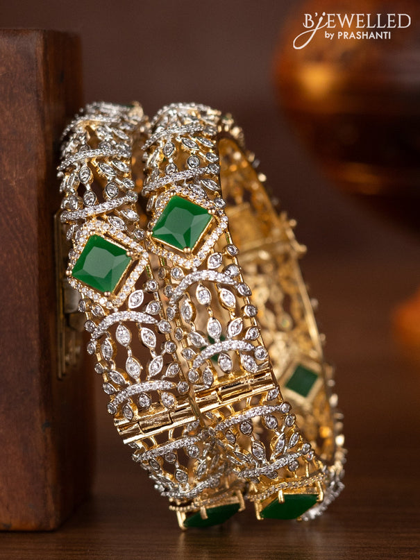 Zircon bangles with emerald and cz stones in gold finish