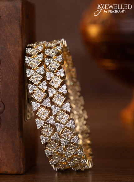 Zircon bangles with cz stones in gold finish