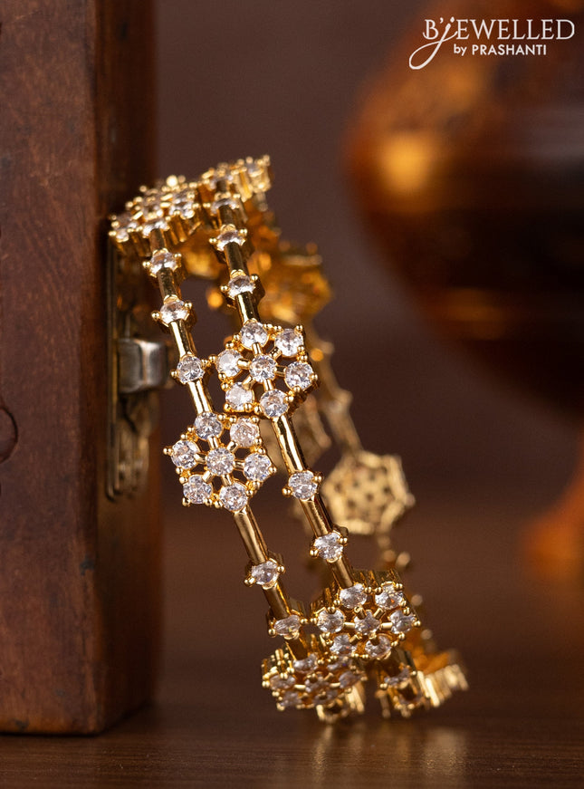 Zircon bangles with cz stones in gold finish