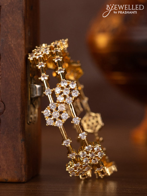 Zircon bangles with cz stones in gold finish