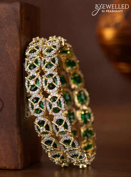 Zircon bangles with emerald and cz stones in gold finish