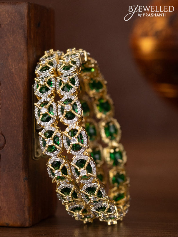 Zircon bangles with emerald and cz stones in gold finish