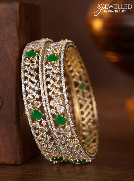 Zircon bangles with emerald and cz stones in gold finish