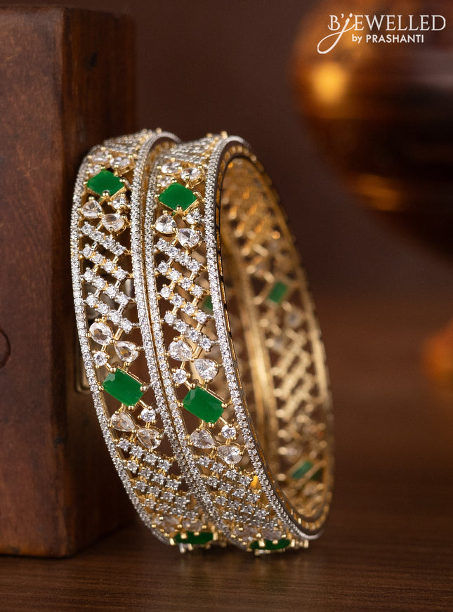 Zircon bangles with emerald and cz stones in gold finish