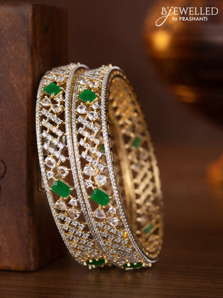 Zircon bangles with emerald and cz stones in gold finish