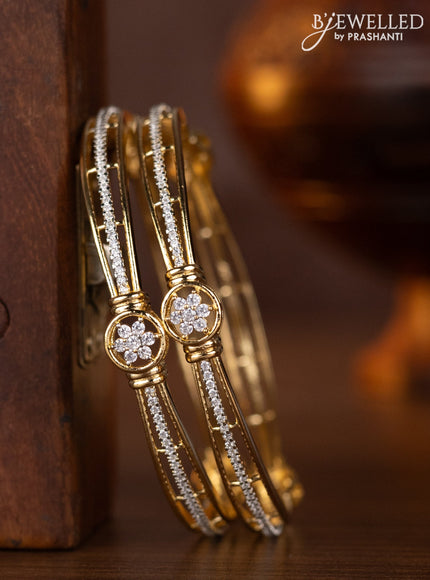 Zircon bangles with cz stones in gold finish