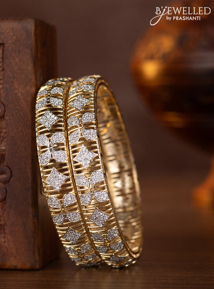 Zircon bangles with cz stones in gold finish