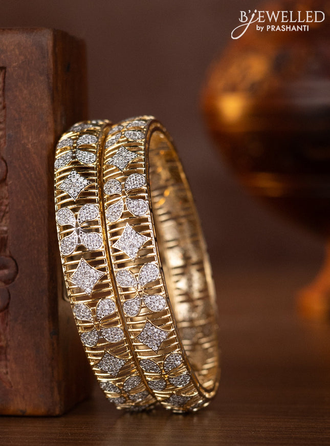 Zircon bangles with cz stones in gold finish