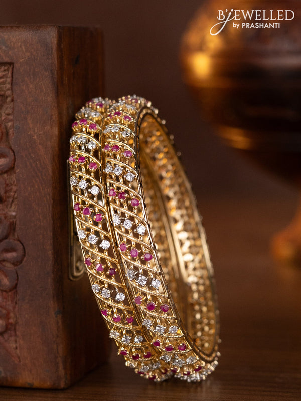 Zircon bangles with ruby and cz stones in gold finish