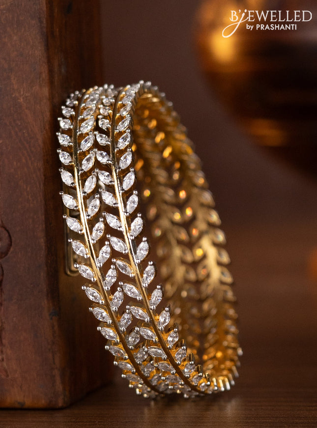 Zircon bangles with cz stones in gold finish