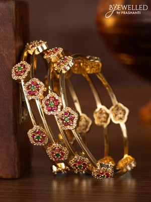Zircon bangles with kemp and cz stones in gold finish