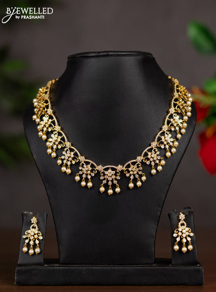 Zircon necklace with cz stones and pearl hangings in gold finish