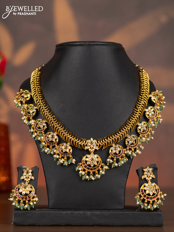 Antique necklace chandbali design with kemp & cz stones and pearl & mint green beads hangings