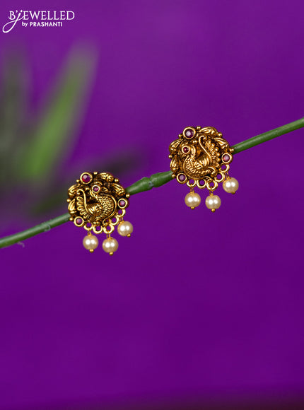 Antique earring peacock design with ruby stones and pearl hangings