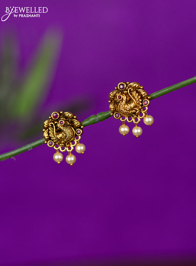 Antique earring peacock design with ruby stones and pearl hangings