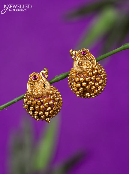 Antique earring with ruby stone and golden beads hangings