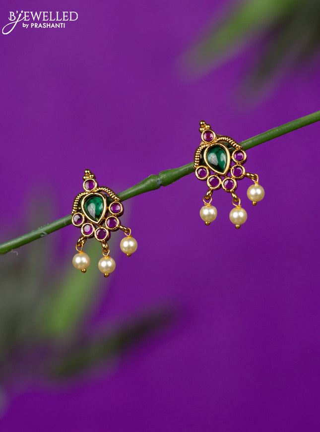 Antique earring with ruby stones and pearl hangings
