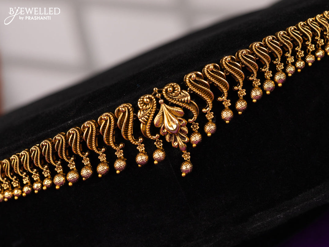 Antique hip chain in floral design with golden ball hanging