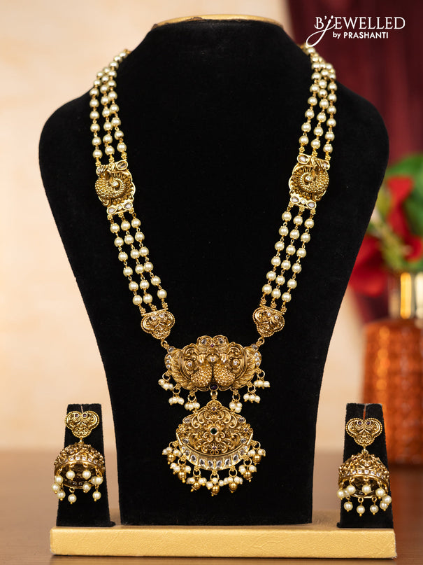 Pearl haaram peacock design with kemp & kundan stones and pearl & golden beads hangings