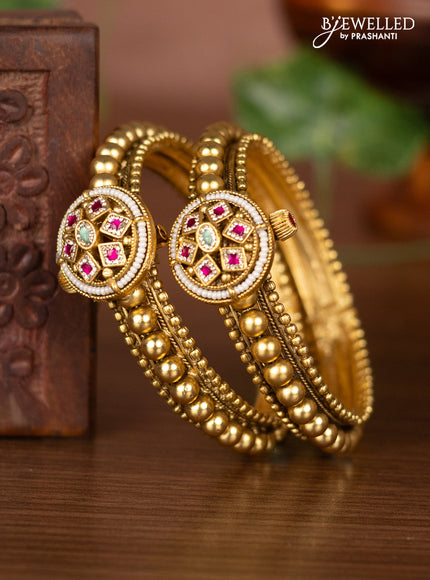 Antique screw type bangles with ruby & mint green and cz stones
