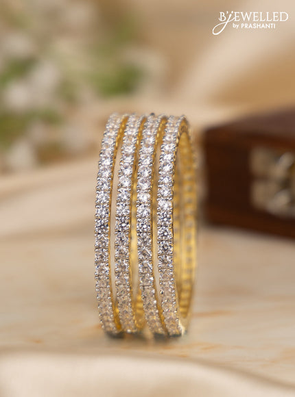 Zircon bangles with cz stones in gold finish