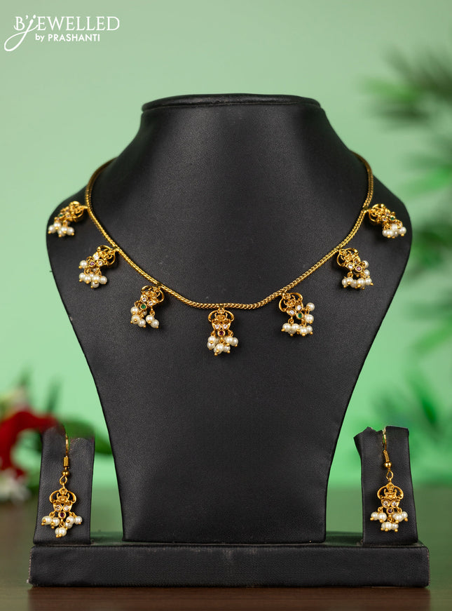 Attigai necklace with lakshmi pendant in kemp stones and pearl hanging
