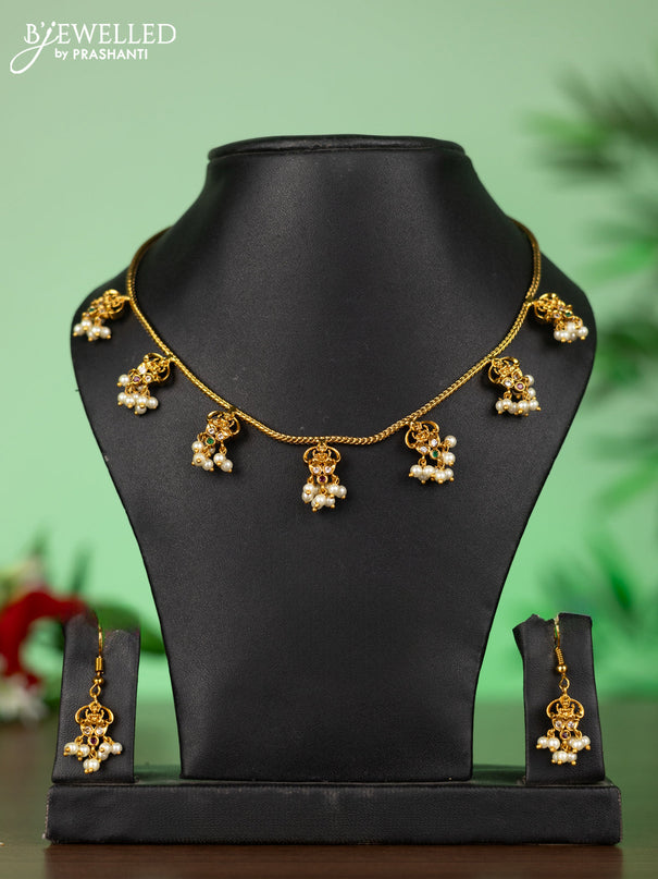 Attigai necklace with lakshmi pendant in kemp stones and pearl hanging
