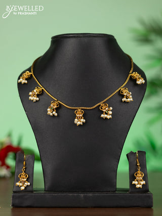 Attigai necklace with lakshmi pendant in kemp stones and pearl hanging