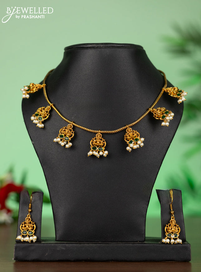 Attigai necklace with lakshmi pendant in green stones and pearl hanging