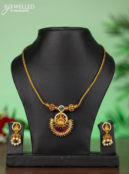 Attigai necklace with lakshmi pendant in kemp and green stones