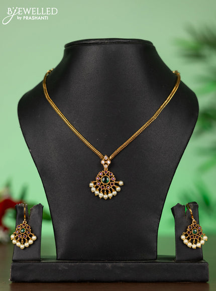 Attigai necklace with floral pendant in kemp ,white and green stones
