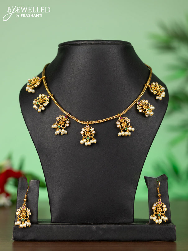 Attigai necklace with lakshmi pendant in kemp stones and pearl hanging