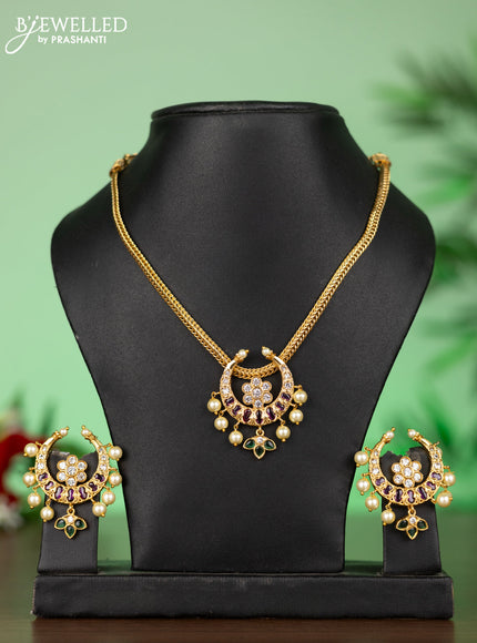 Attigai necklace with chandbali pendant in kemp,green stones and pearl hangings